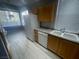Bright kitchen with stainless steel appliances, white dishwasher, and ample granite counter space at 15 E Agate Ave # 202, Las Vegas, NV 89123