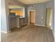 Open-concept living area featuring wood-style flooring and neutral paint at 15 E Agate Ave # 202, Las Vegas, NV 89123