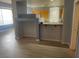 Open-concept space showcasing kitchen with a breakfast bar at 15 E Agate Ave # 202, Las Vegas, NV 89123