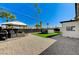 Backyard with patio seating area and an above-ground pool with desert landscaping at 1660 Izabella Ave, Las Vegas, NV 89169