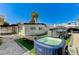 Backyard featuring an above ground pool, enclosed hot tub, and desert landscaping at 1660 Izabella Ave, Las Vegas, NV 89169