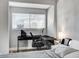 Bedroom with a dedicated desk area and a well-lit window at 1660 Izabella Ave, Las Vegas, NV 89169