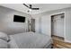 This bedroom boasts a ceiling fan and a large sliding door closet at 1660 Izabella Ave, Las Vegas, NV 89169