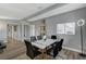 Bright dining area featuring modern table, stylish chairs, and wood-look floors at 1660 Izabella Ave, Las Vegas, NV 89169
