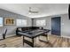 Well-lit game room featuring a pool table, comfortable sofa, and modern decor at 1660 Izabella Ave, Las Vegas, NV 89169