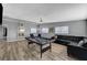 Spacious living room with pool table, dining area, comfortable seating, and modern flooring at 1660 Izabella Ave, Las Vegas, NV 89169