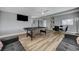 Open-concept living space with a pool table, dining area, and a comfortable sofa at 1660 Izabella Ave, Las Vegas, NV 89169