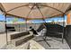 Enclosed outdoor patio with furniture, grill, and shade under a canopy at 1660 Izabella Ave, Las Vegas, NV 89169