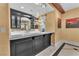 Contemporary bar area with black cabinetry, granite countertop, and unique lighting at 1795 Anelli Ct, Henderson, NV 89012
