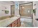 Elegant bathroom showcasing a granite countertop, a tub with tile surround, and bronze fixtures at 1795 Anelli Ct, Henderson, NV 89012