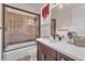 Well-maintained bathroom showcasing tiled shower with glass door and vanity with white countertop at 1795 Anelli Ct, Henderson, NV 89012