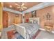 Tranquil bedroom with a ceiling fan, decorative accents, and plenty of natural light at 1795 Anelli Ct, Henderson, NV 89012