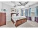 Bright bedroom with a ceiling fan, natural light, and neutral tones throughout at 1795 Anelli Ct, Henderson, NV 89012