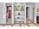 Walk-in closet with open shelving and a view into another room, all on tile flooring at 1795 Anelli Ct, Henderson, NV 89012