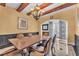 Charming dining room with a large wooden table and elegant decor at 1795 Anelli Ct, Henderson, NV 89012