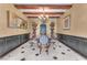 Elegant dining room with wooden ceiling beams, chandelier, and seating for six at 1795 Anelli Ct, Henderson, NV 89012