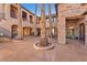 Expansive exterior features multiple balconies, courtyards with palm trees, offering a luxurious outdoor living at 1795 Anelli Ct, Henderson, NV 89012