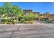 Stately stone home featuring manicured landscaping and a three car garage at 1795 Anelli Ct, Henderson, NV 89012