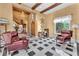 Spacious foyer features stone accents, hardwood floors, and sitting area at 1795 Anelli Ct, Henderson, NV 89012