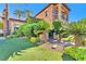 An exquisite home showcasing lush landscaping, stone accents, and well manicured turf at 1795 Anelli Ct, Henderson, NV 89012