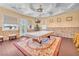Entertainment room with pool table, custom lighting, bar area, and multiple windows for natural light at 1795 Anelli Ct, Henderson, NV 89012