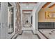 Elegant hallway with white walls, marble floors, and decorative accents at 1795 Anelli Ct, Henderson, NV 89012