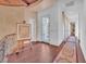 Hallway with dark hardwood floors, light walls, and decorative rug at 1795 Anelli Ct, Henderson, NV 89012