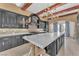 Gorgeous kitchen with a marble island, custom cabinets, and high-end appliances at 1795 Anelli Ct, Henderson, NV 89012