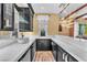 Stylish kitchen with marble countertops, black cabinets, and elegant fixtures at 1795 Anelli Ct, Henderson, NV 89012