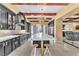 Stunning kitchen featuring a large marble island and black cabinetry at 1795 Anelli Ct, Henderson, NV 89012