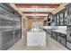 Elegant kitchen featuring a large marble island and stainless steel appliances at 1795 Anelli Ct, Henderson, NV 89012