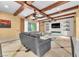 Comfortable living room with stylish furniture, beamed ceilings, and lots of light at 1795 Anelli Ct, Henderson, NV 89012