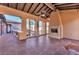 Outdoor patio with a fireplace, ceiling fan, and tile flooring, perfect for relaxing or entertaining at 1795 Anelli Ct, Henderson, NV 89012