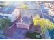 Aerial view of property showcasing a two-story home with well-kept landscaping, driveway, and front yard at 189 Kings Canyon Court Ct, Henderson, NV 89012