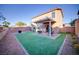 Spacious backyard features a covered patio, low maintenance landscaping, and block wall at 189 Kings Canyon Court Ct, Henderson, NV 89012