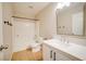 Well-lit bathroom featuring a shower-tub combo and a white vanity with a large mirror at 189 Kings Canyon Court Ct, Henderson, NV 89012