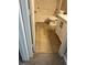 Updated bathroom with wood-look floors, a white vanity, and a tub and shower combo at 189 Kings Canyon Court Ct, Henderson, NV 89012