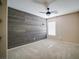 Bedroom featuring a decorative accent wall, soft carpet, and a modern ceiling fan at 189 Kings Canyon Court Ct, Henderson, NV 89012