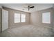 Neutral bedroom with plush carpeting and multiple windows for natural light at 189 Kings Canyon Court Ct, Henderson, NV 89012