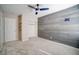 Neutral bedroom featuring a wood accent wall and closet at 189 Kings Canyon Court Ct, Henderson, NV 89012