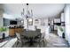 Open-concept dining area with a view to the living room and modern kitchen at 189 Kings Canyon Court Ct, Henderson, NV 89012