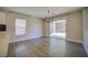 Bright dining room with sliding glass doors to the backyard and view into the kitchen space at 189 Kings Canyon Court Ct, Henderson, NV 89012