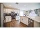 Modern kitchen with stainless steel appliances, a breakfast bar, and ample counter space at 189 Kings Canyon Court Ct, Henderson, NV 89012