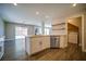 Beautiful kitchen featuring stainless appliances, an island, and an adjacent laundry area at 189 Kings Canyon Court Ct, Henderson, NV 89012