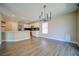 Open kitchen with white cabinets, granite counters, and stainless appliances at 189 Kings Canyon Court Ct, Henderson, NV 89012