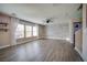 Spacious living room with modern flooring, accent wall, and natural light from large windows at 189 Kings Canyon Court Ct, Henderson, NV 89012