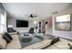 Staged living room includes wood floors, decorative wall, and comfortable seating at 189 Kings Canyon Court Ct, Henderson, NV 89012
