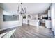 Open-concept living space connecting the living room and kitchen with modern finishes at 189 Kings Canyon Court Ct, Henderson, NV 89012