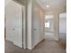 Upstairs hallway with multiple doors leading to bedrooms, carpeted floor at 209 Tainted Berry Ave, North Las Vegas, NV 89031