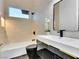 Modern bathroom features a sleek vanity, stylish fixtures, and herringbone tile floors at 211 Granite Ct, Boulder City, NV 89005